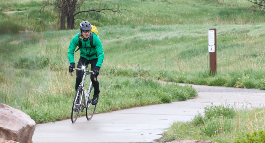 Man riding in daylight with bike headlight